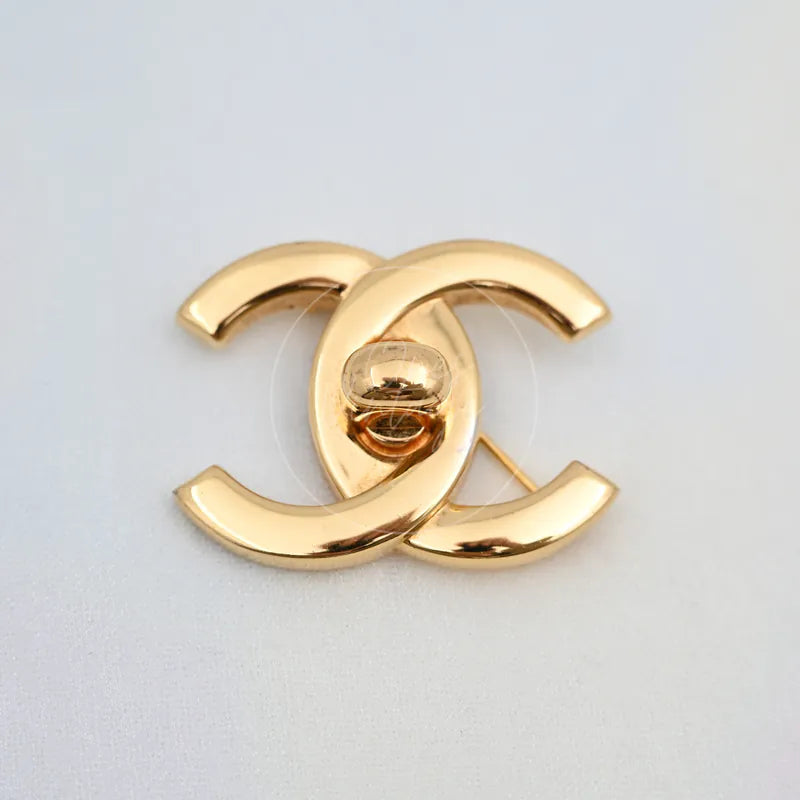 Chanel Vintage CC Logo 24K Plated Brooch in 24K gold-plated, featuring interlocking CC silhouette and central clasp mechanism, back view