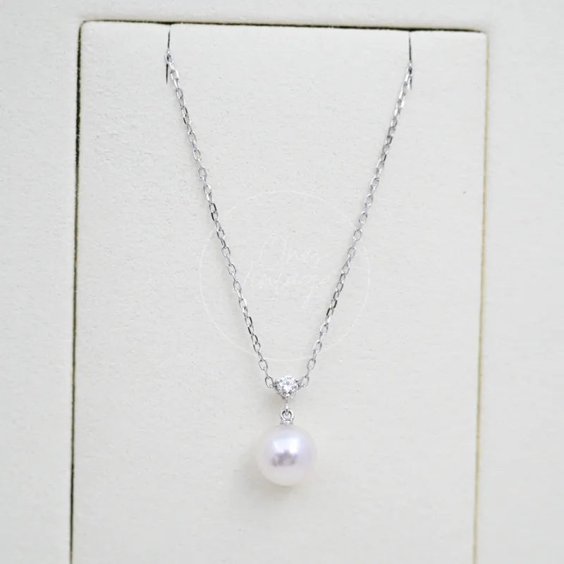 Tasaki Akoya Pendant Necklace in platinum, diamond and akoya pearl, featuring delicate link chain and single drop pendant, front view