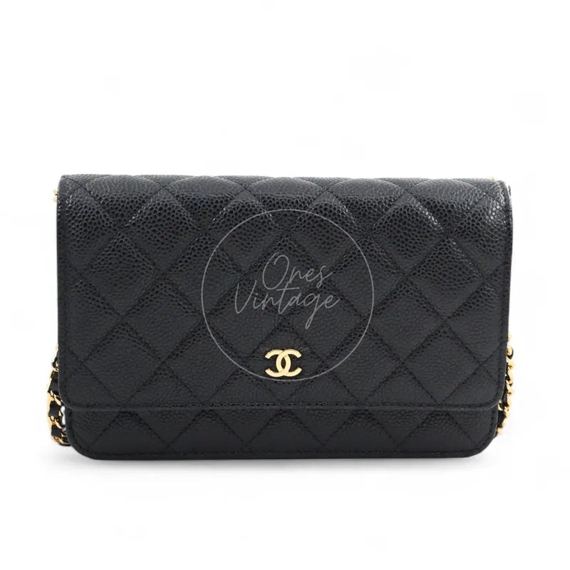 Chanel Wallet on Chain in black quilted caviar leather with gold hardware, Series 22, front view