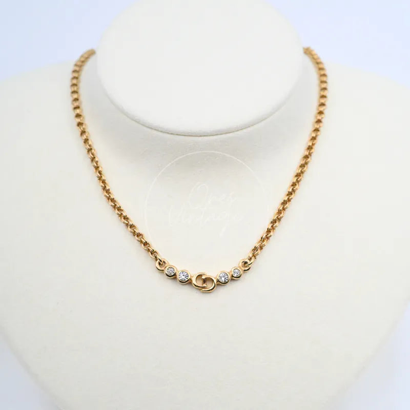 Dior CD Logo Necklace in alloy metal and rhinestone, featuring round pendant with central emblem and rhinestone accents, front view
