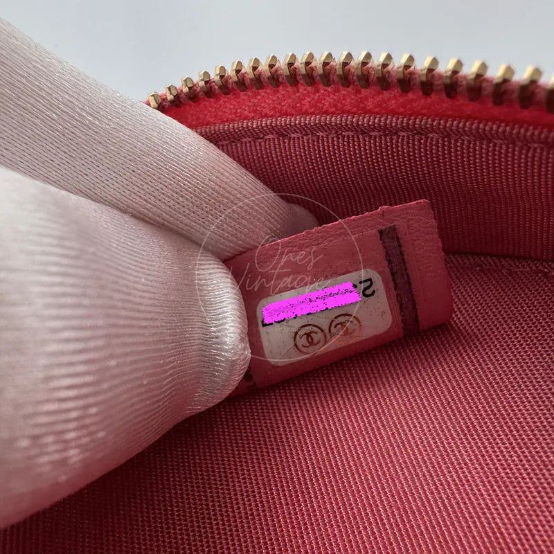 Chanel round clutch bag in pink camellia-embossed caviar leather with gold hardware, Series 29, Series 29 serial sticker close-up
