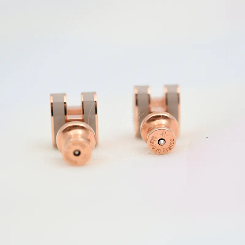 Hermès Mini Pop H Earrings Grey With Pink Gold in gold-plated alloy metal, featuring paired earring backs and circular post fittings, back view