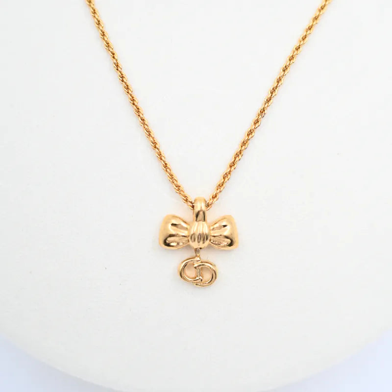 Dior Vintage Ribbon Necklace, bow-shaped pendant and dangling circular loop detail