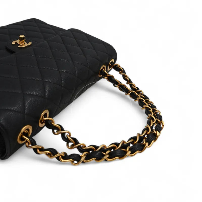 Chanel Jumbo Classic Flap Bag, interwoven chain strap and gold-tone strap attachments detail