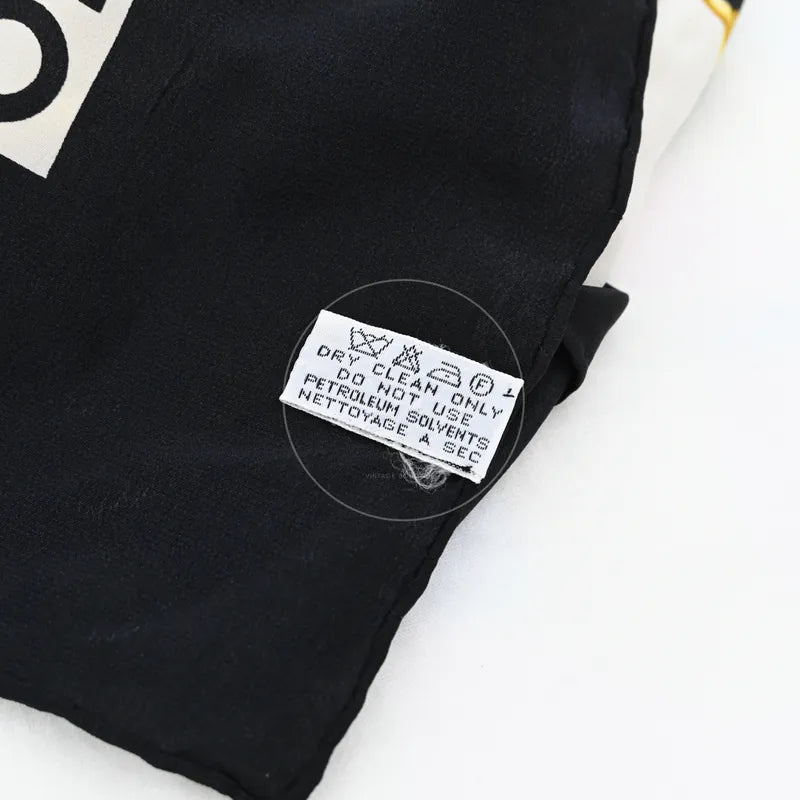 Chanel and Scarf, sewn care label and black textile edge detail