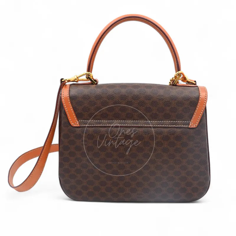 Celine Vintage Macadam Turn Lock Handbag in brown pvc, featuring monogram pattern with detachable shoulder strap, front view