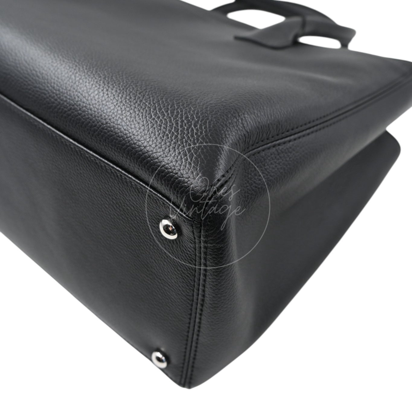 Chanel Cerf Executive Shopper medium tote in black calfskin with silver-tone hardware, Series 14, front left base corner and protective feet