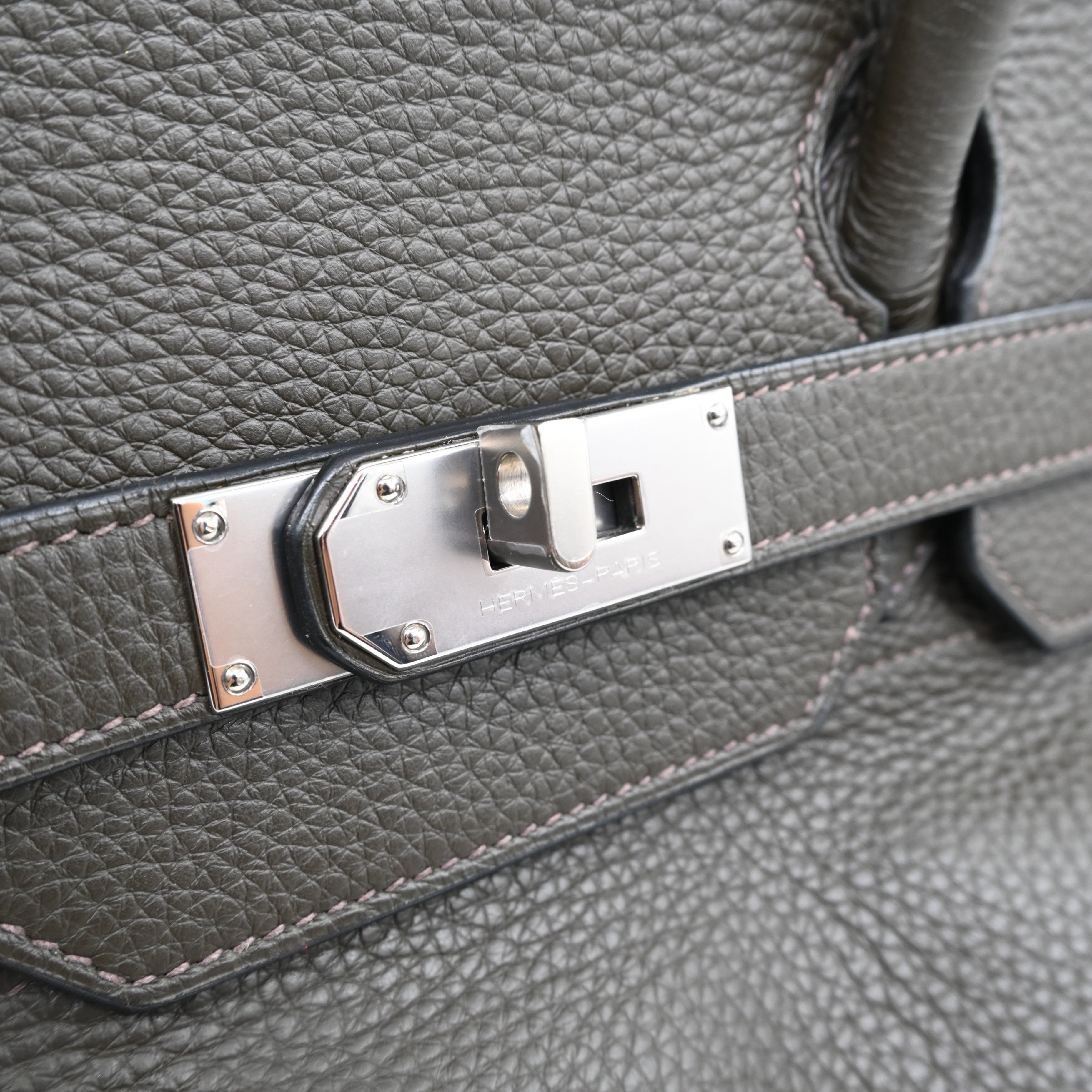 Close-up of Hermes-Paris engraving on silver-tone palladium hardware