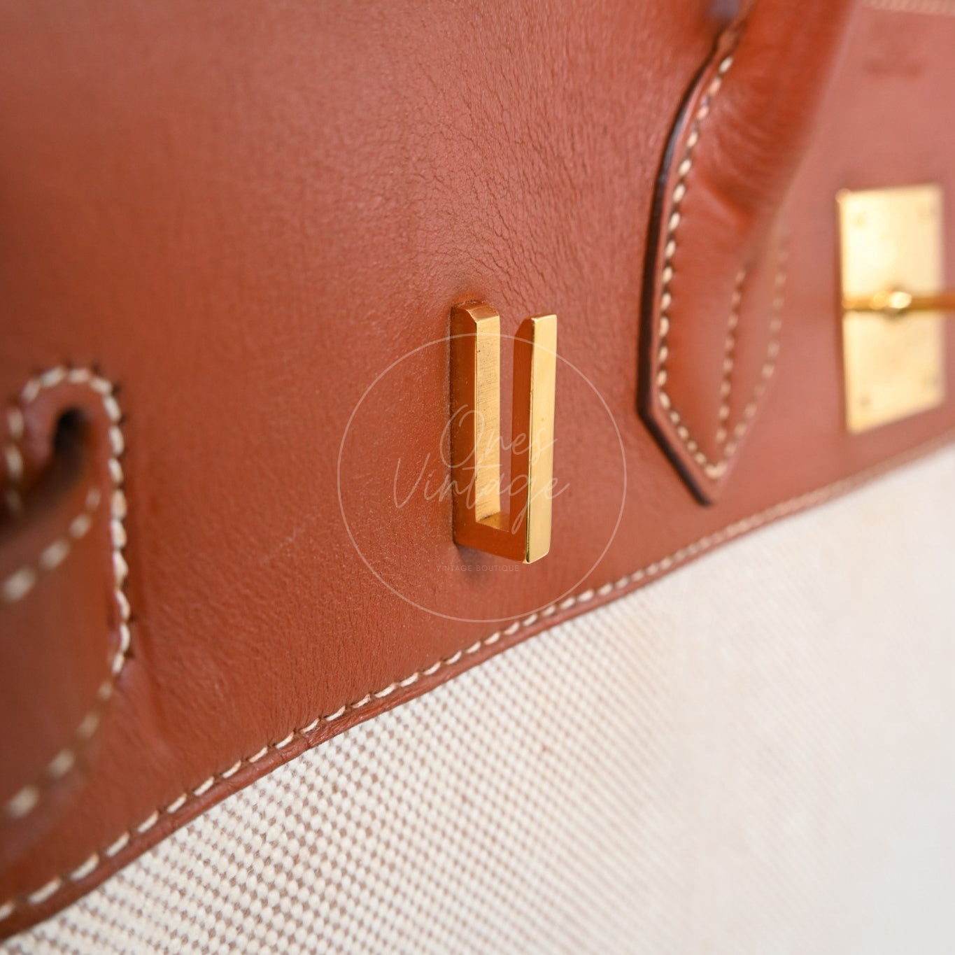 Hermès Haut à Courroies 32 in Fauve Barenia leather and beige toile with gold-tone hardware, Circle X stamp, right turn-lock post close-up