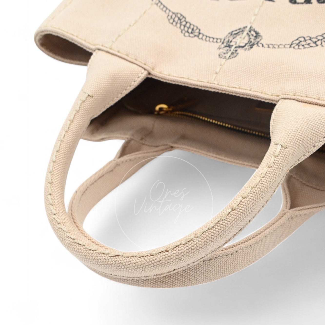 Top view of Prada Canapa bag showing canvas handles and open interior compartment