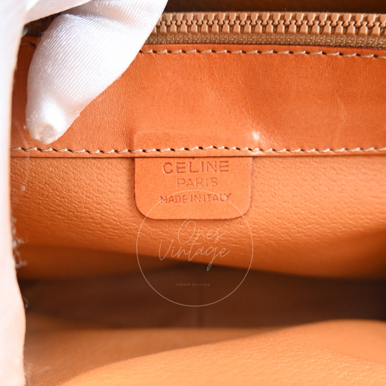 Debossed CELINE PARIS MADE IN ITALY logo stamp on interior leather tag inside vintage bag