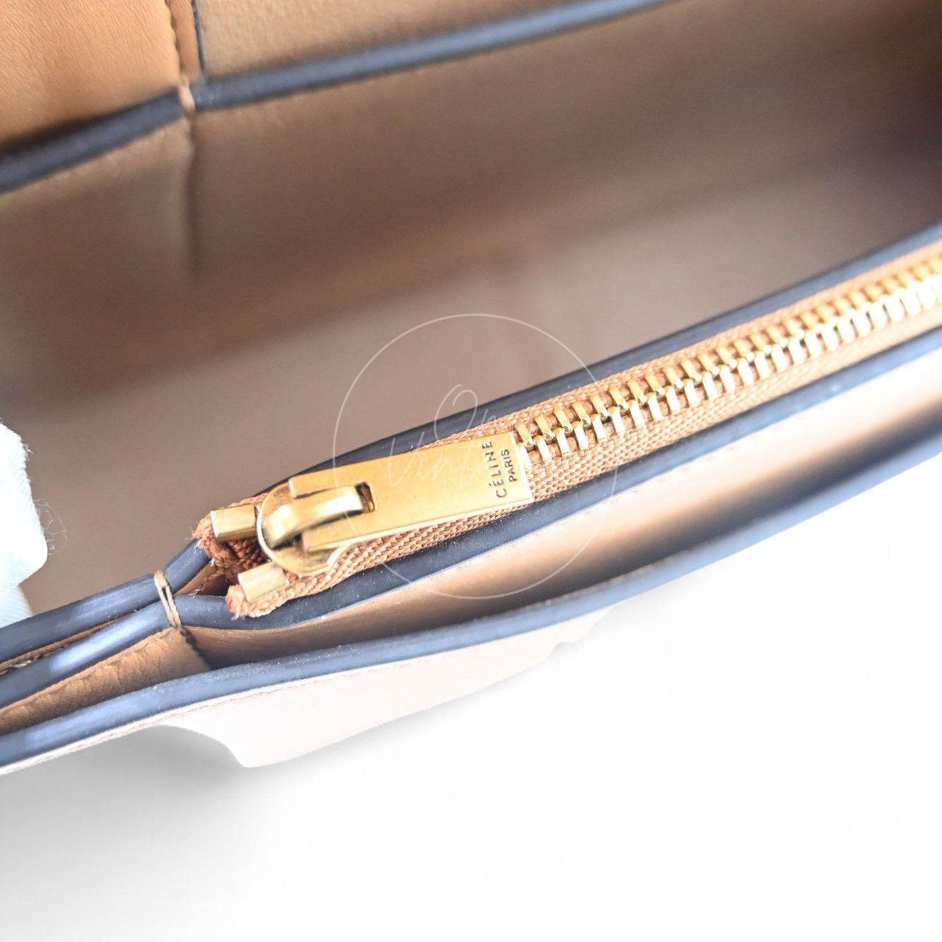 Close-up of Celine Frame bag interior gold-tone zipper hardware with CÉLINE PARIS engraving
