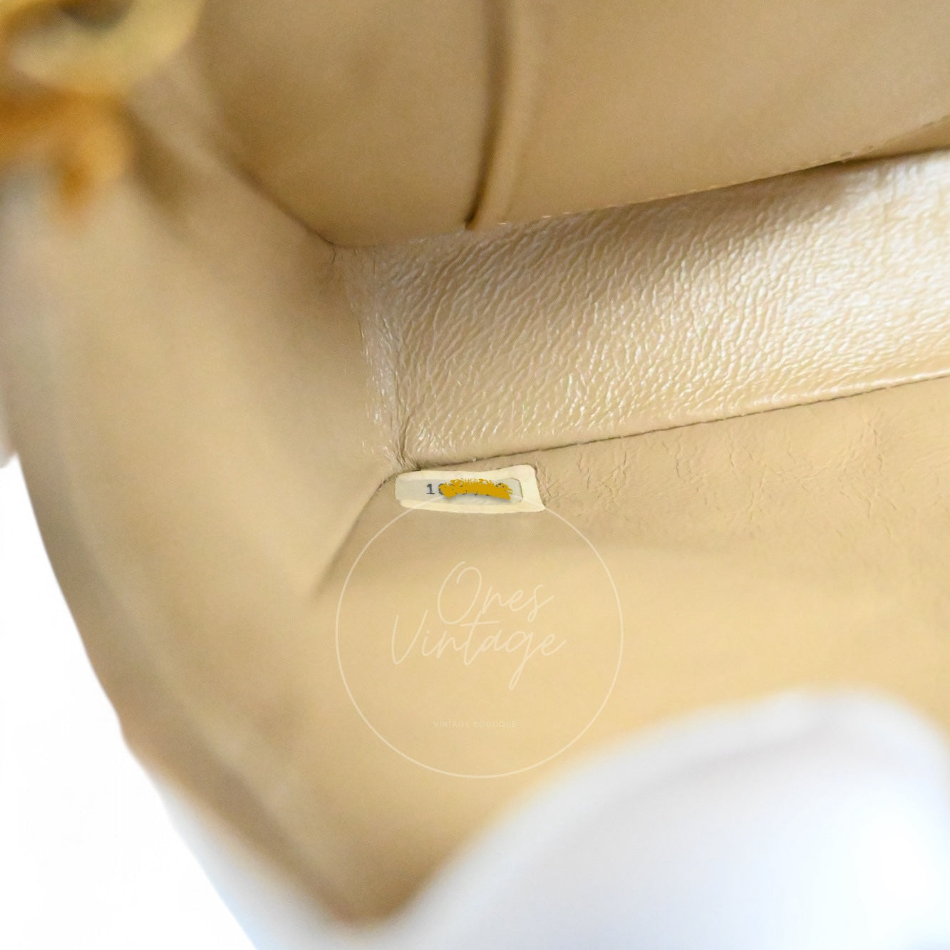 Chanel vintage 1-series serial number hologram sticker inside the beige leather lining