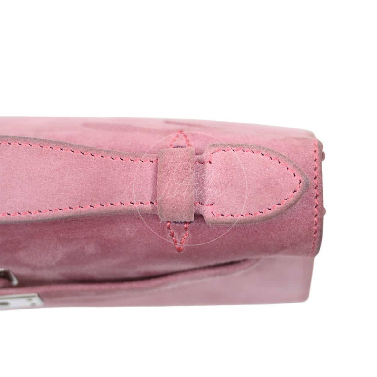 Hermès Kelly Pochette Veau Doblis in pink suede, stitched handle attachment tab and rounded handle base detail