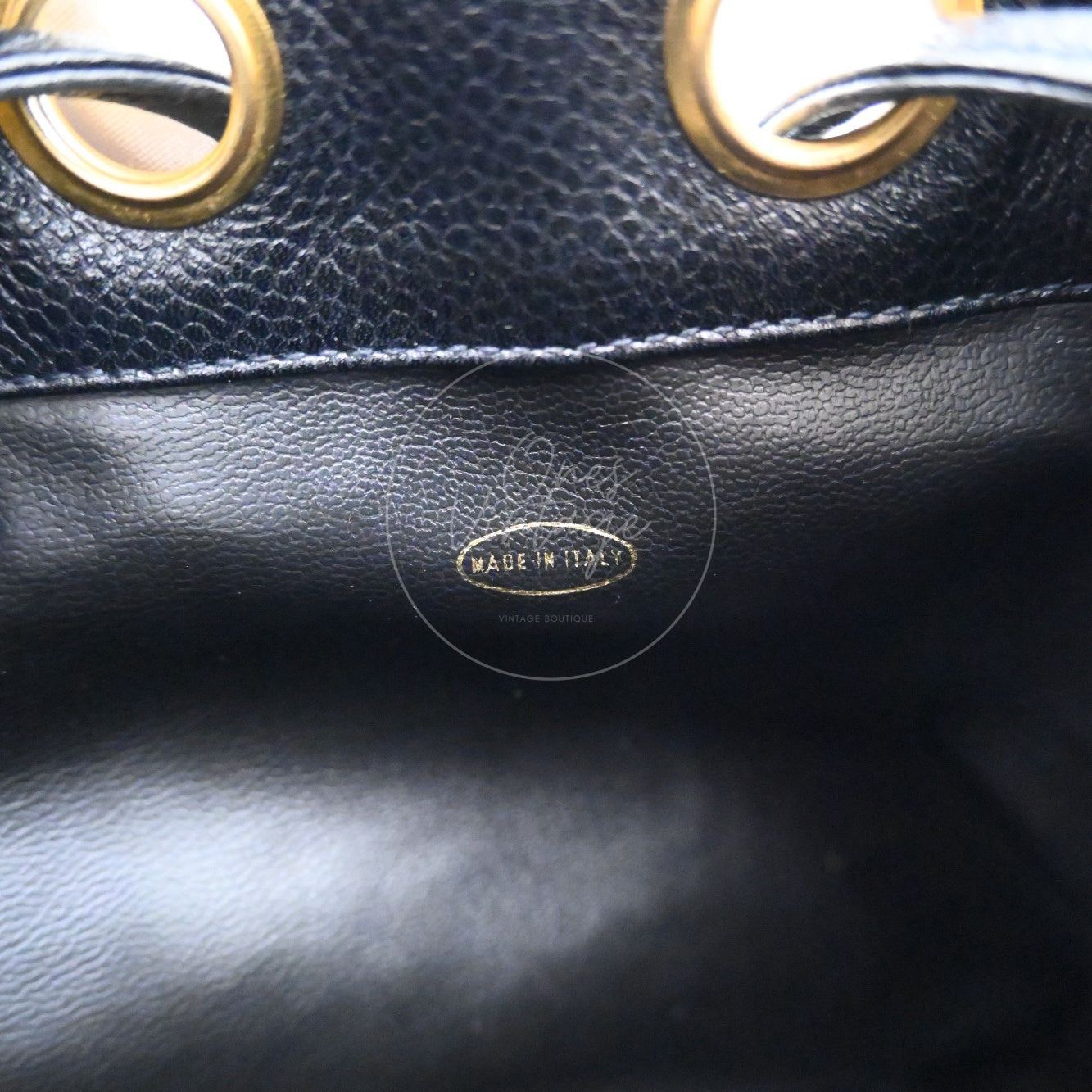Gold foil MADE IN ITALY oval stamp inside vintage Chanel bucket bag