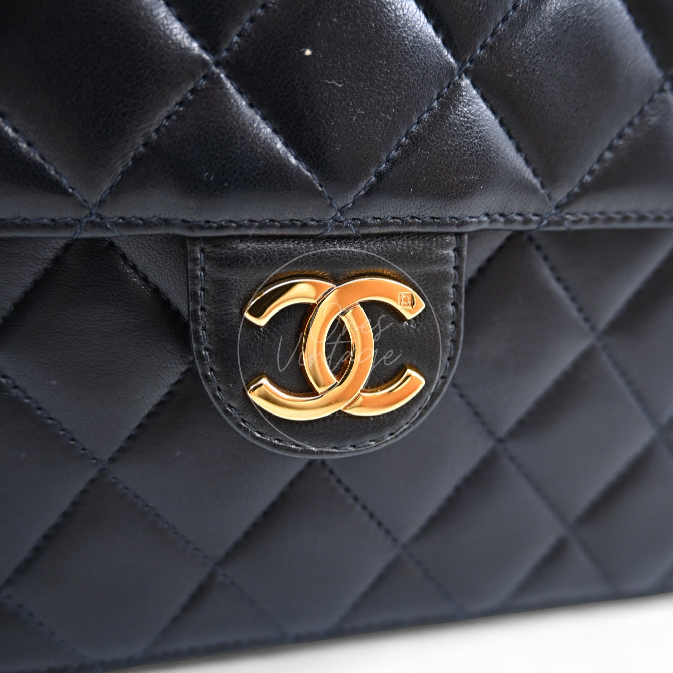 Close-up of Chanel vintage 24k gold-plated interlocking CC turn-lock hardware