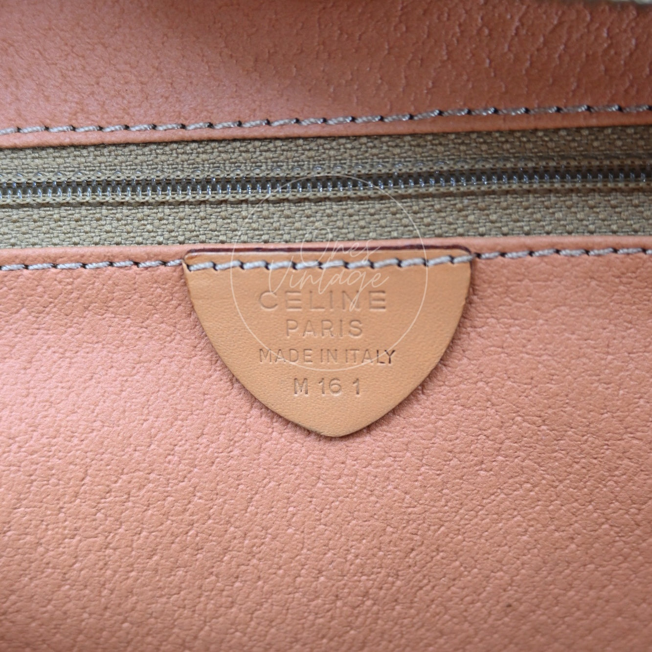 Debossed CELINE PARIS MADE IN ITALY stamp and M 16 1 serial number code on interior leather tag