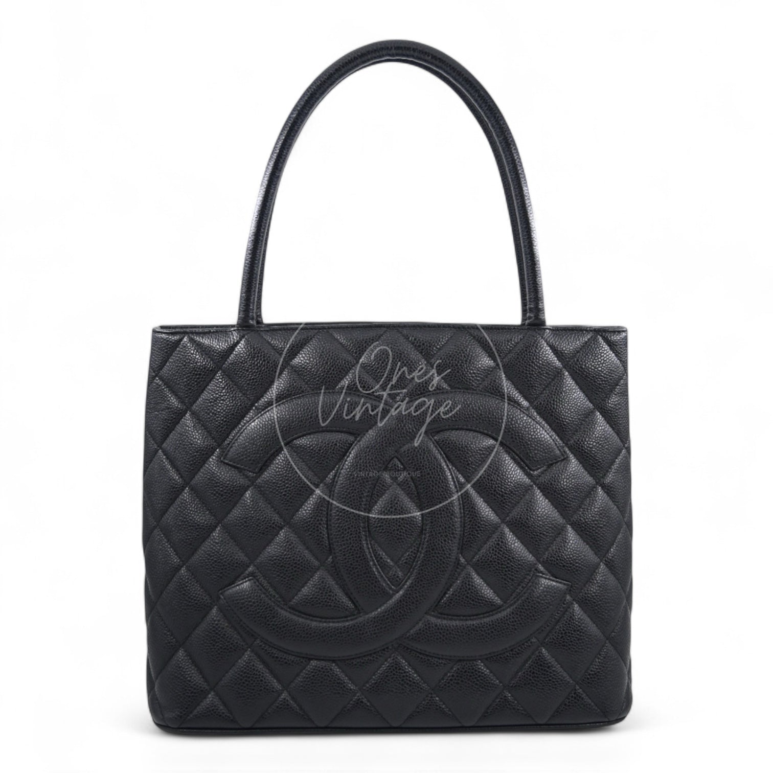 Chanel Vintage Medallion tote bag in black caviar leather with large embossed CC logo front view