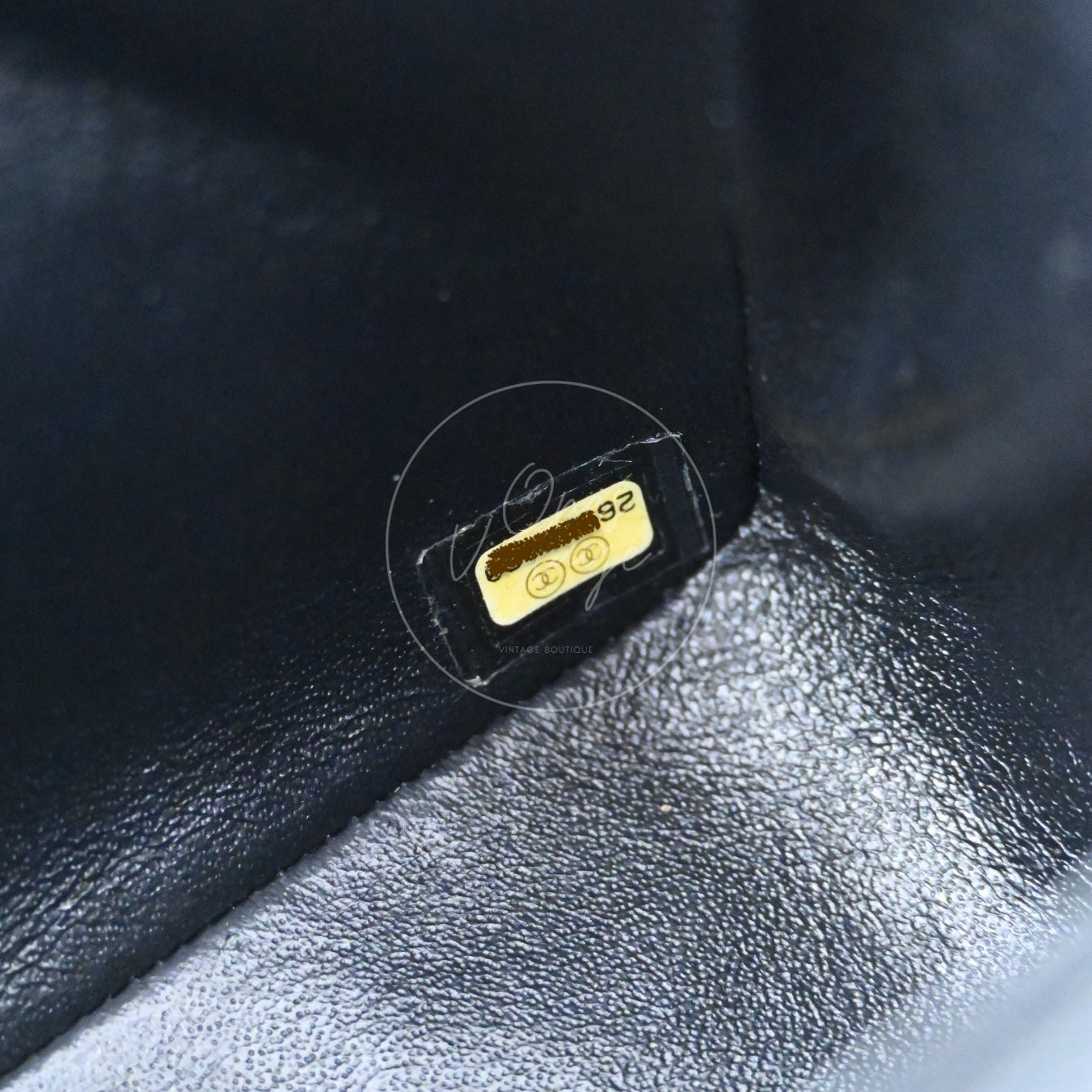 Chanel 26-series serial number hologram sticker with gold CC logo inside black lining