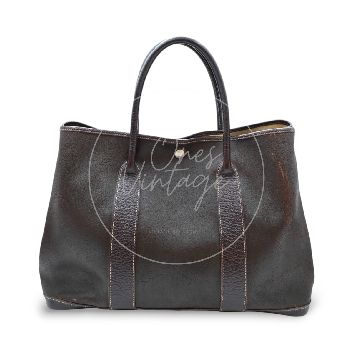 Hermès Garden Party 36 Amazon tote in dark brown rubber with leather trim, front view with twin leather handles and silver-tone snaps