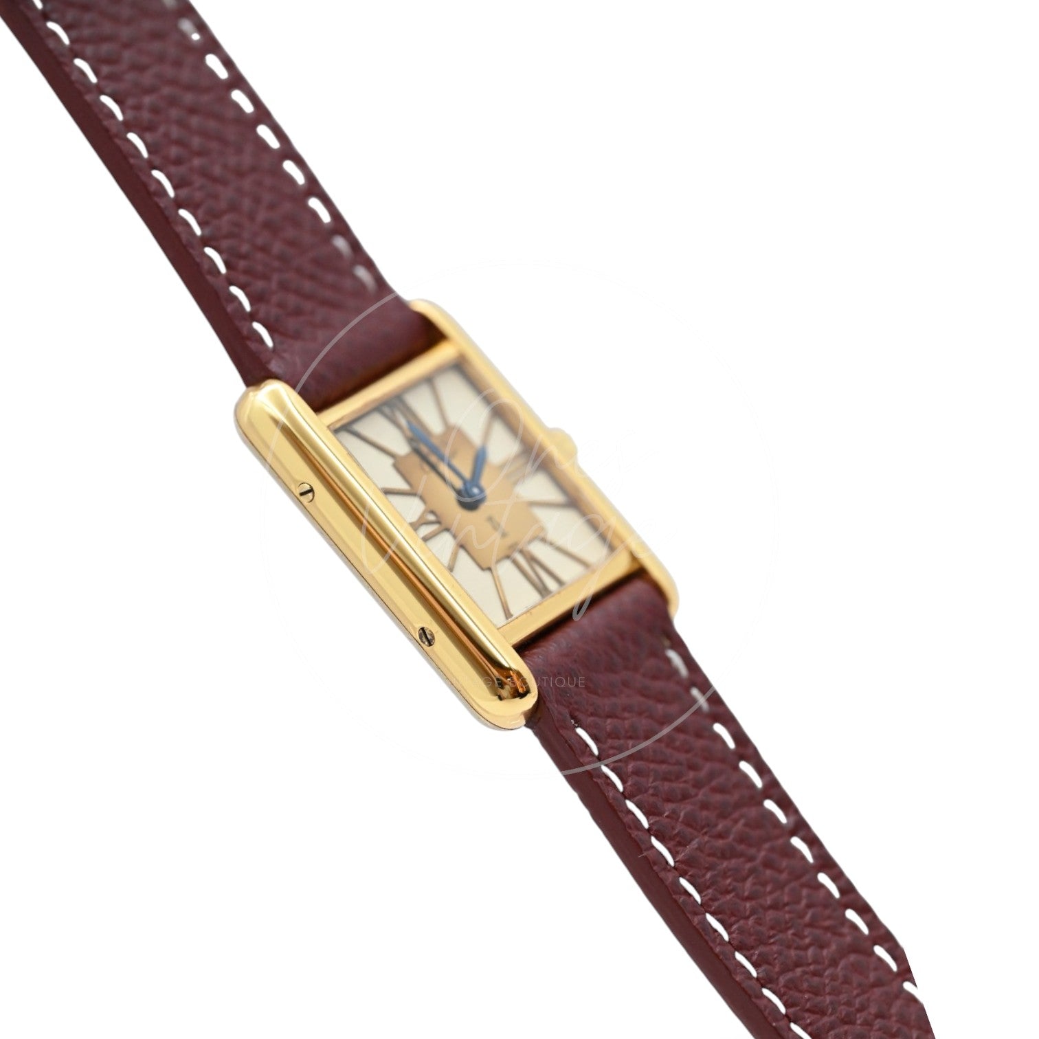 Cartier Must de Tank quartz watch with ivory Roman numeral dial and maroon leather strap, angled left profile of the vermeil case and dial