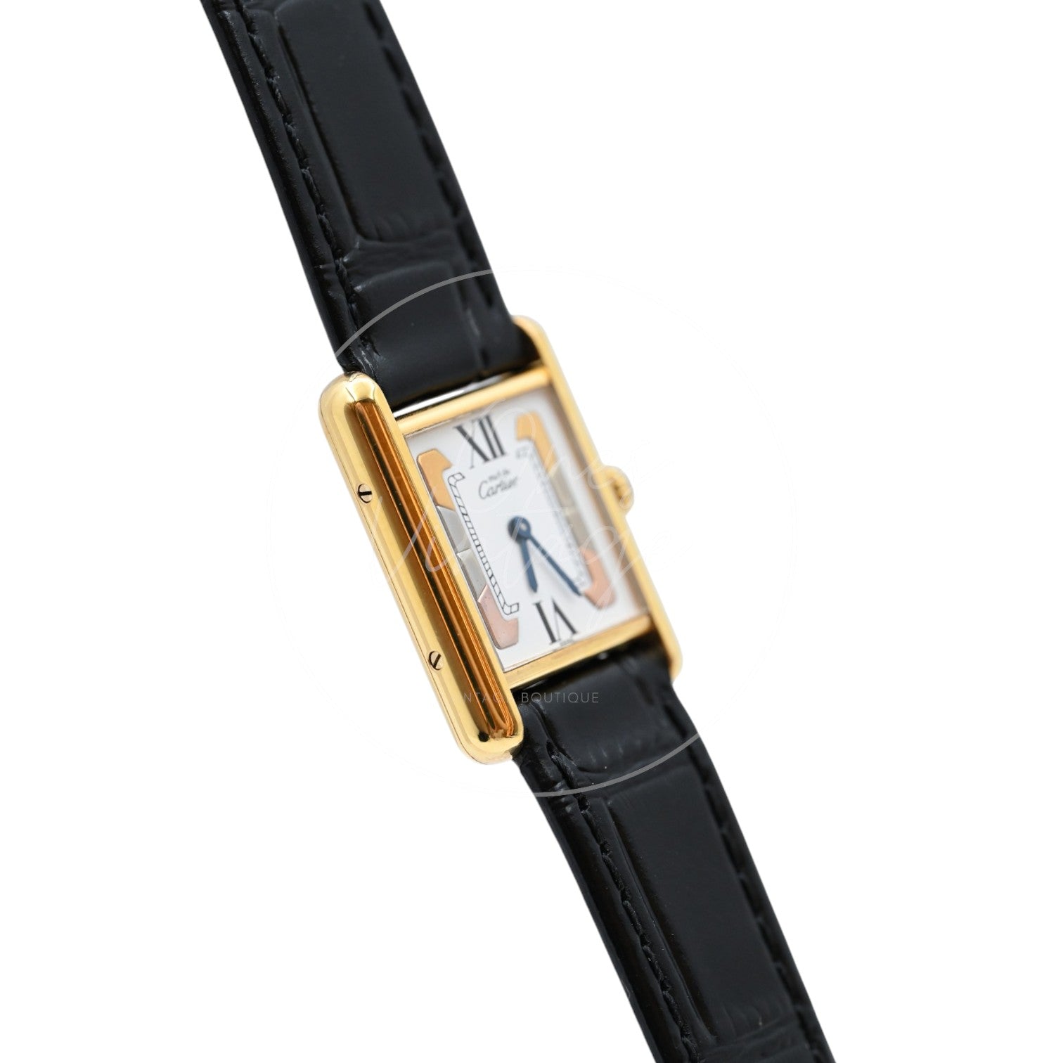 Cartier Must de Tank Trinity dial quartz watch with black leather strap, angled left profile of the rectangular vermeil case
