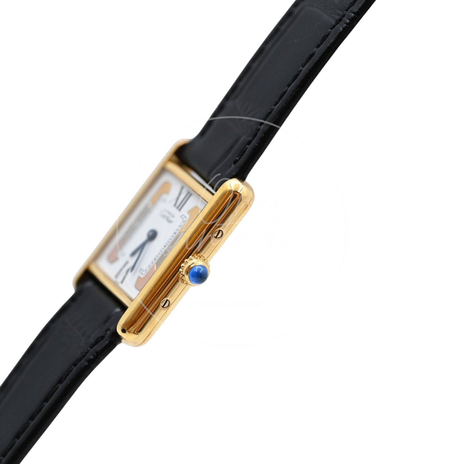 Cartier Must de Tank Trinity dial quartz watch with black leather strap, angled crown-side view with blue cabochon detail