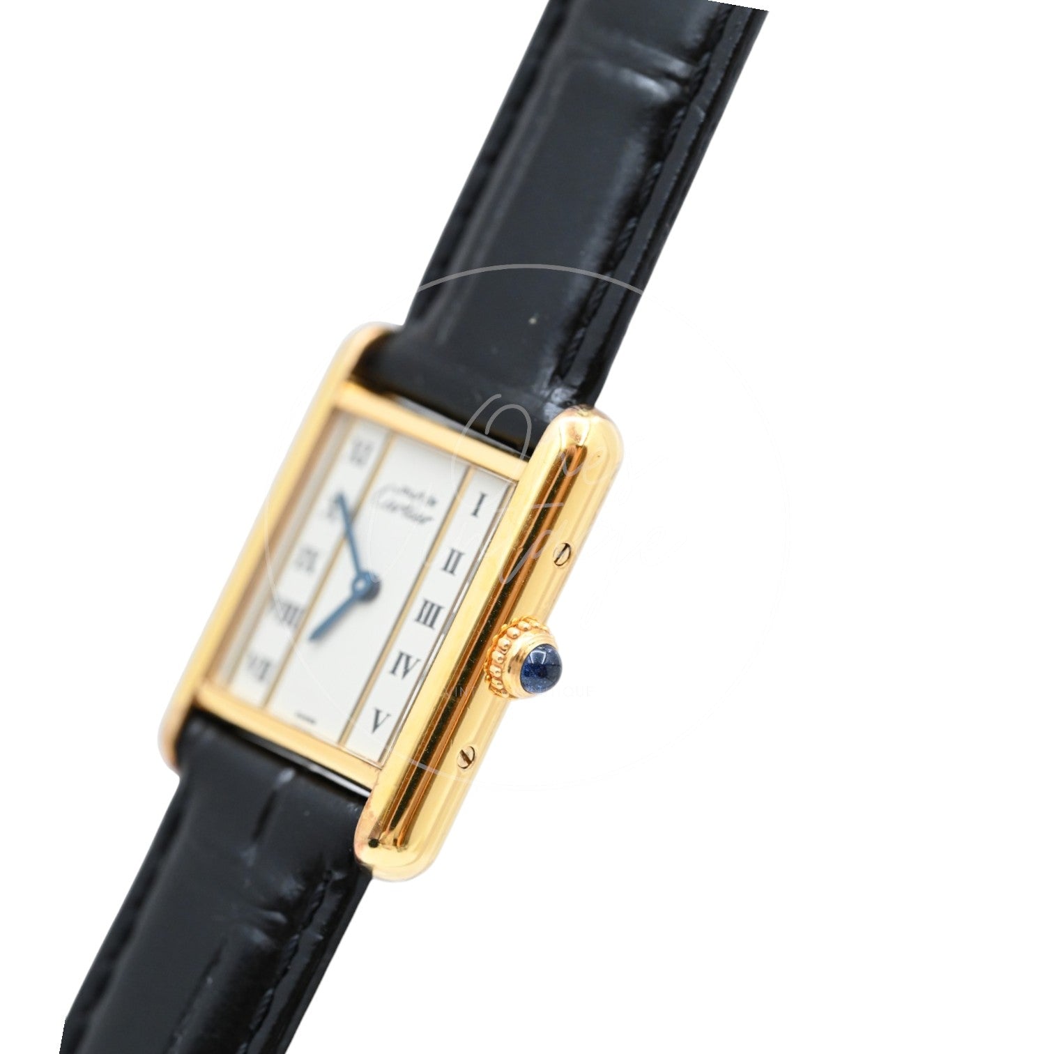 Cartier Must de Tank quartz watch with ivory Roman numeral dial and black leather strap, angled crown-side view with blue cabochon detail