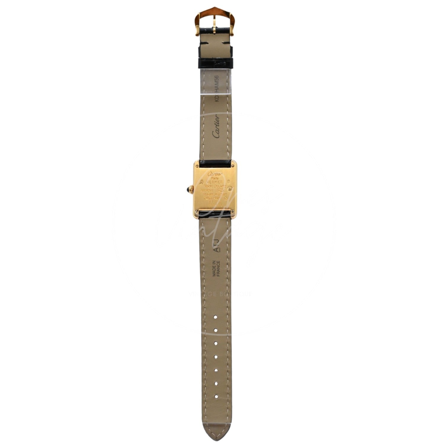 Cartier Must de Tank quartz watch with ivory Roman numeral dial and black leather strap, full rear view showing engraved case back and strap lining
