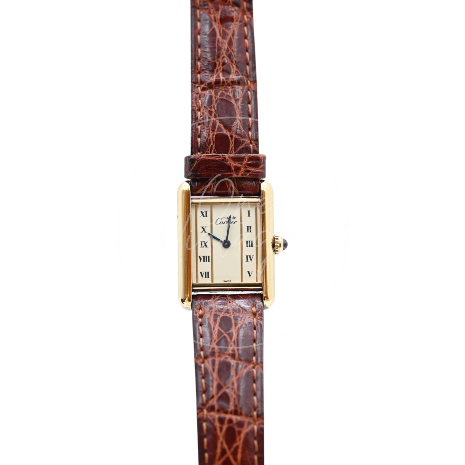 Cartier Must de Tank quartz watch with ivory column Roman dial and brown leather strap, front close-up of rectangular vermeil case and blue hands