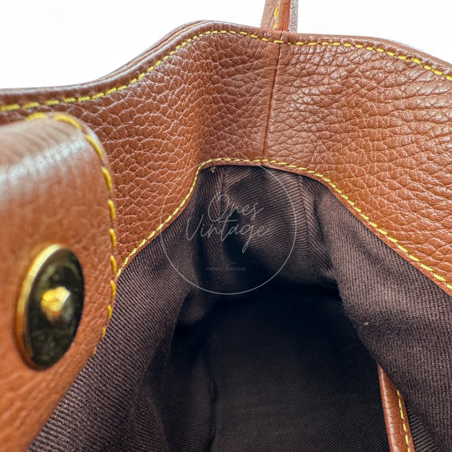 Interior view of Céline vintage denim bag showing clean brown fabric lining