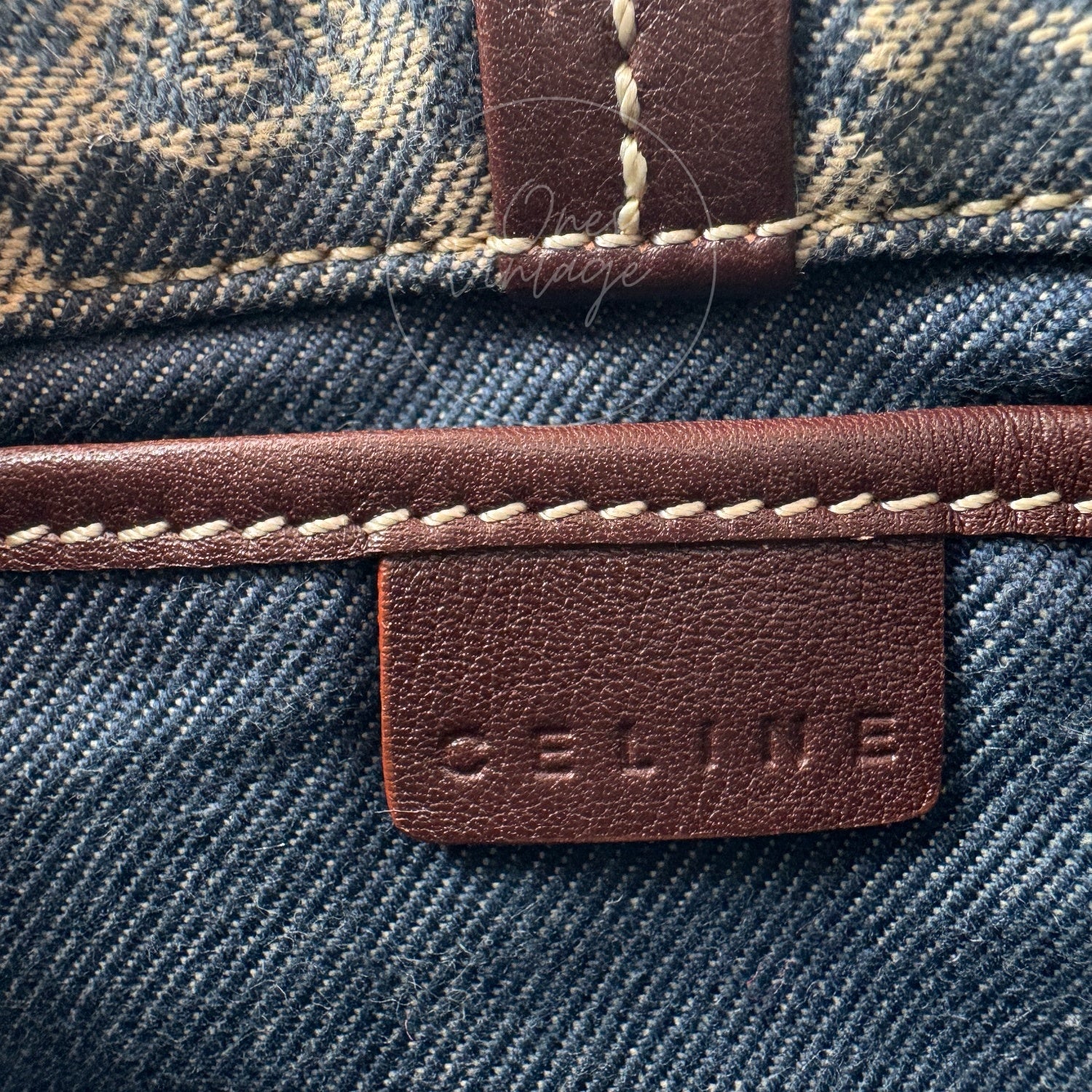 Debossed CELINE logo on interior brown leather tag inside vintage denim bag