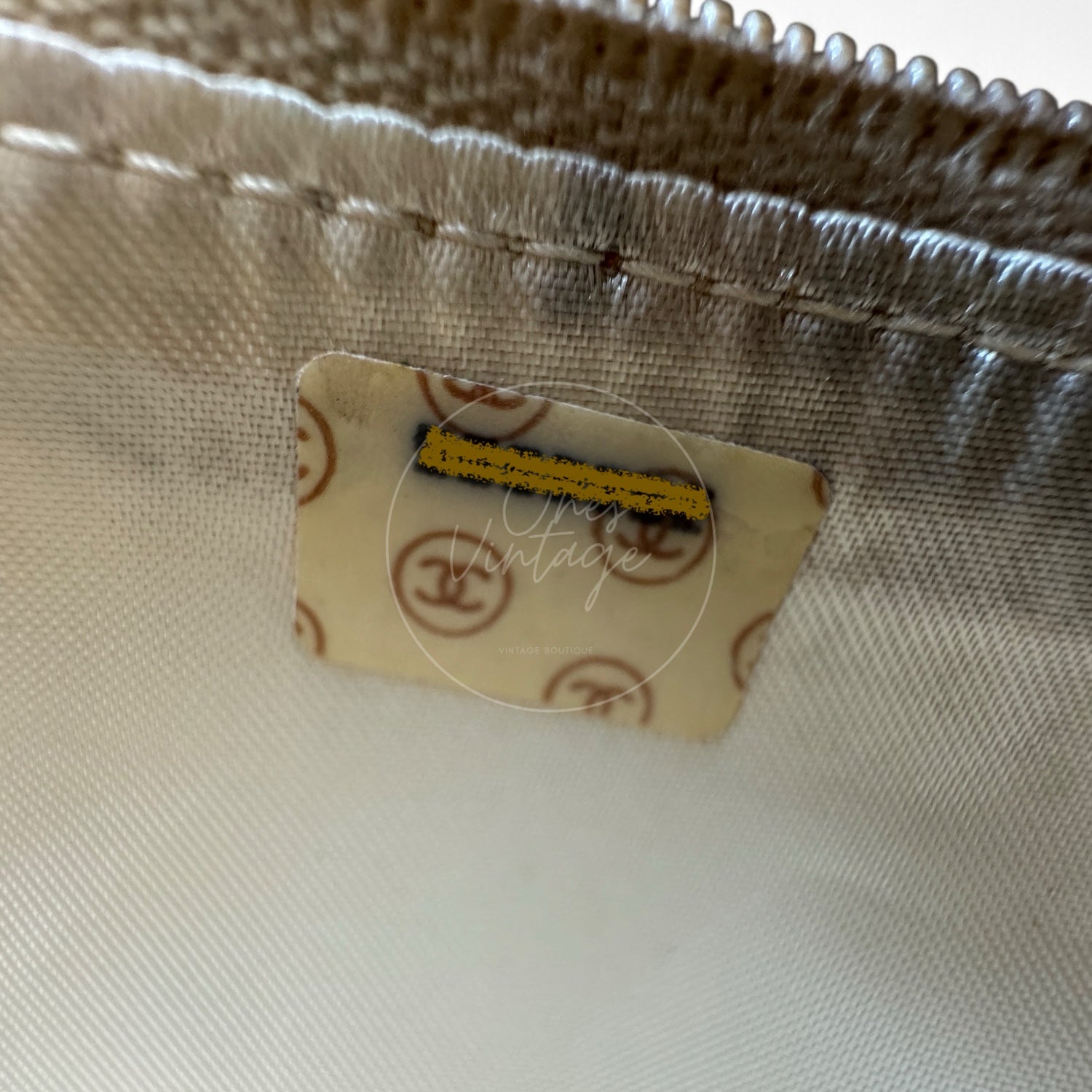 Chanel vintage serial number 2 hologram sticker with CC monogram pattern inside lining