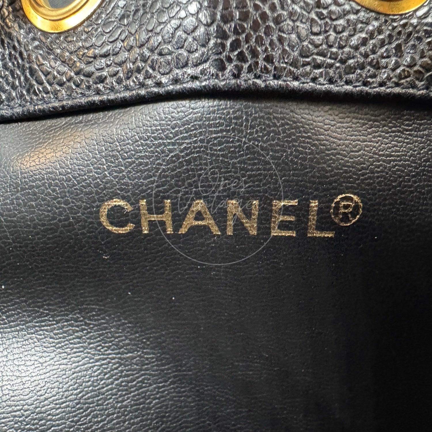 Gold foil CHANEL logo stamp inside vintage caviar leather backpack
