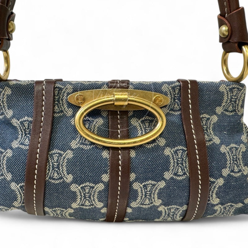 Close-up of vintage Céline gold-tone oval hardware clasp with mini Triomphe logos