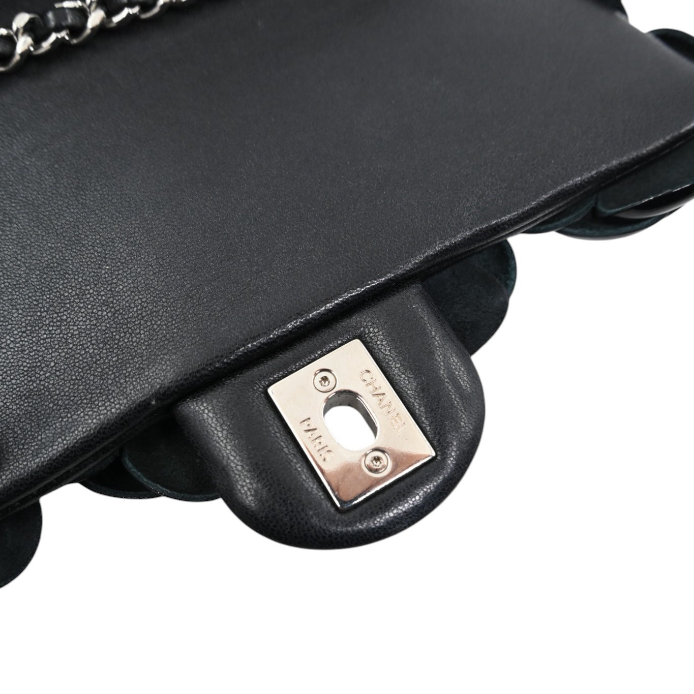 Chanel engraving on the silver-tone hardware inside the flap