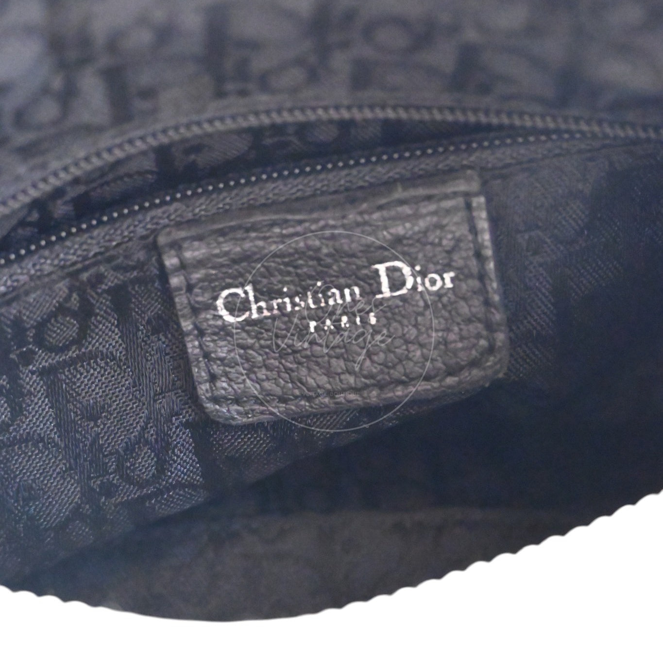 Christian Dior PARIS silver foil logo stamp on black leather tag with Trotter monogram lining
