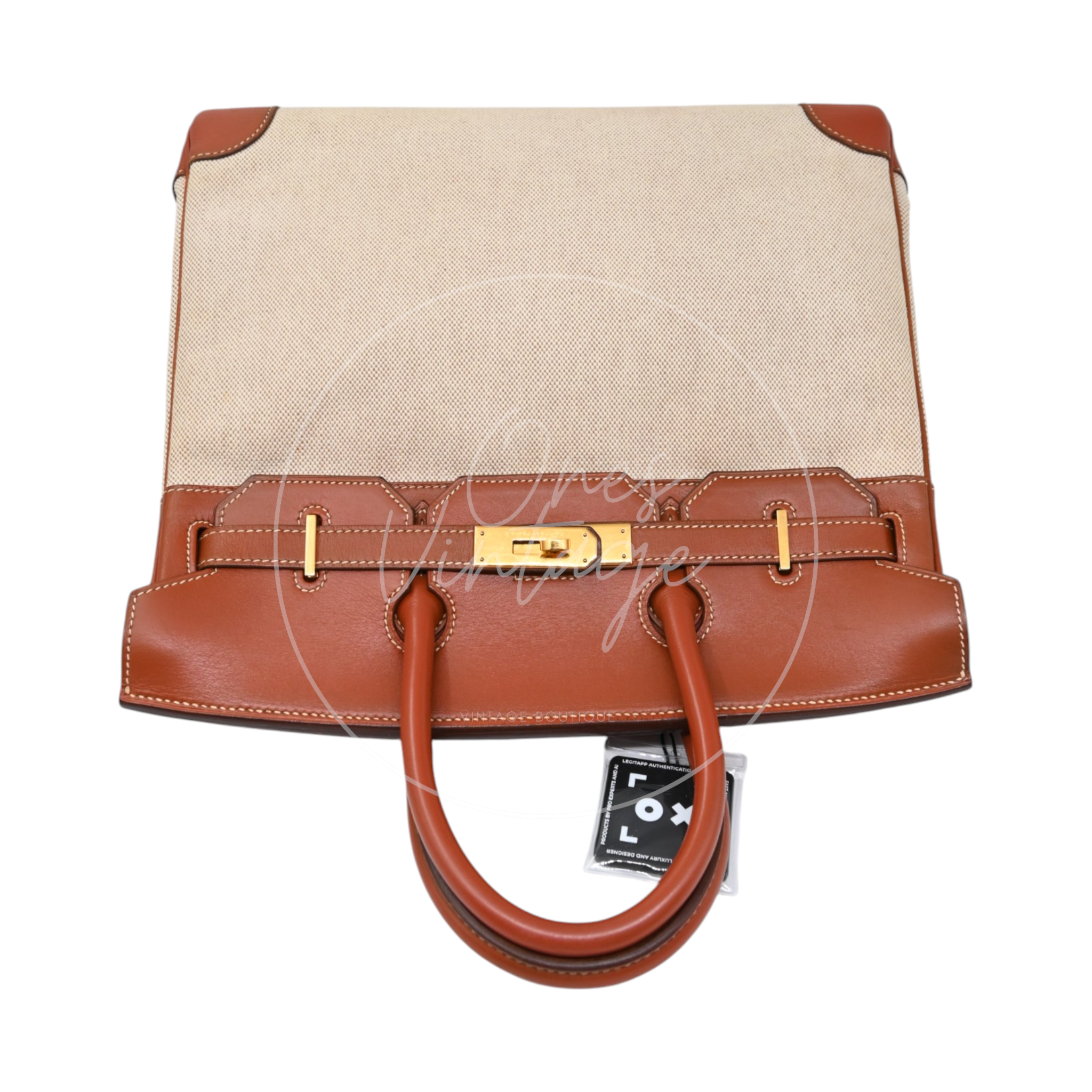Hermès Haut à Courroies 32 in Fauve Barenia leather and beige toile with gold-tone hardware, Circle X stamp, top view with flap closed and handles folded