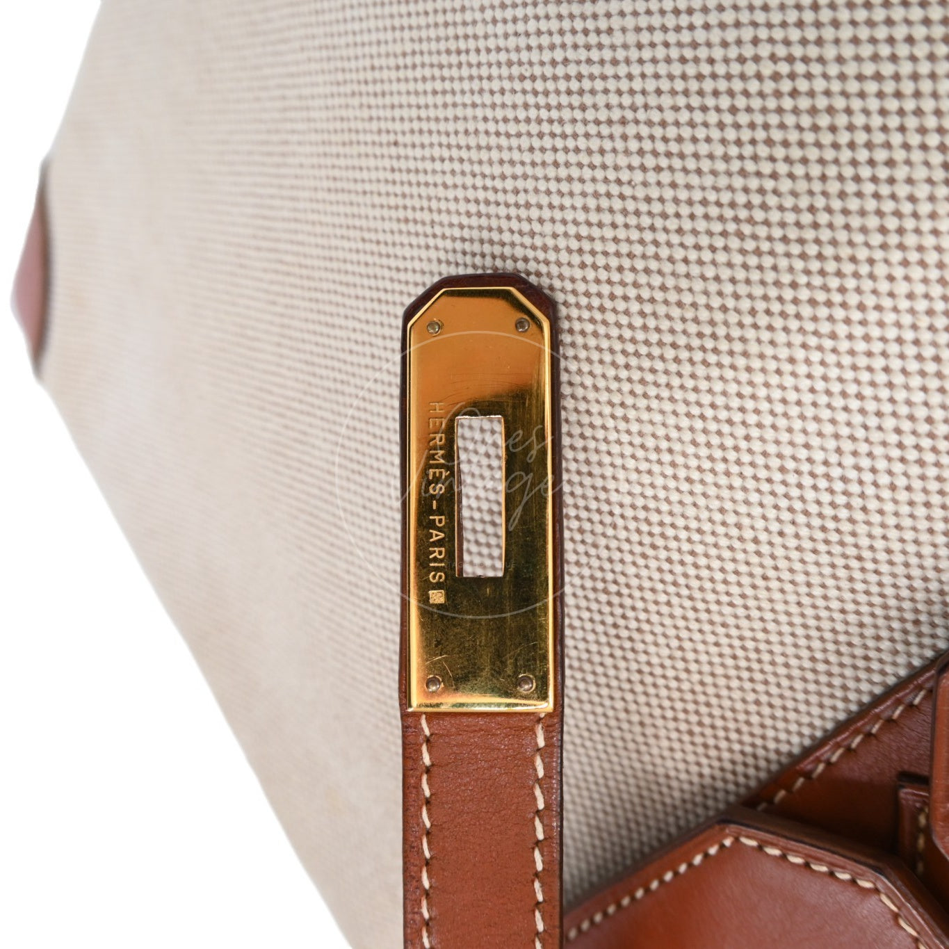 Hermès Haut à Courroies 32 in Fauve Barenia leather and beige toile with gold-tone hardware, Circle X stamp, left closure-strap plate on the toile panel