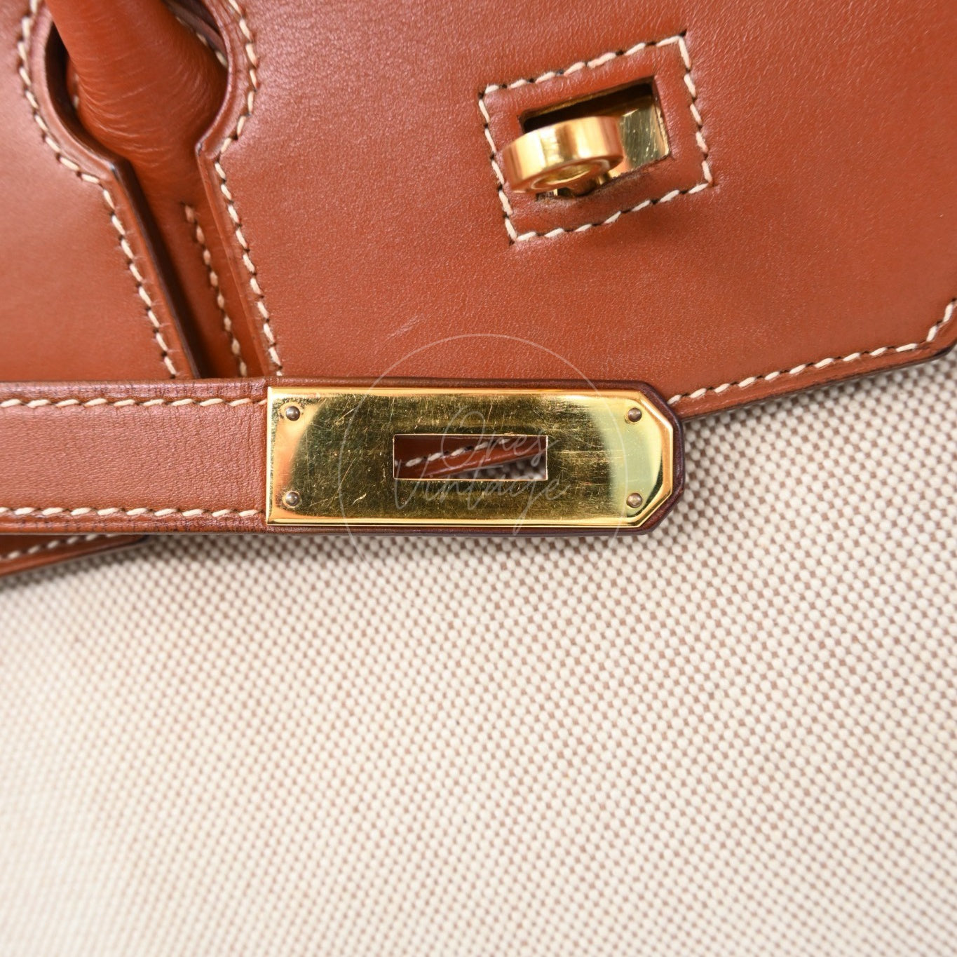 Hermès Haut à Courroies 32 in Fauve Barenia leather and beige toile with gold-tone hardware, Circle X stamp, central turn-lock and closure strap