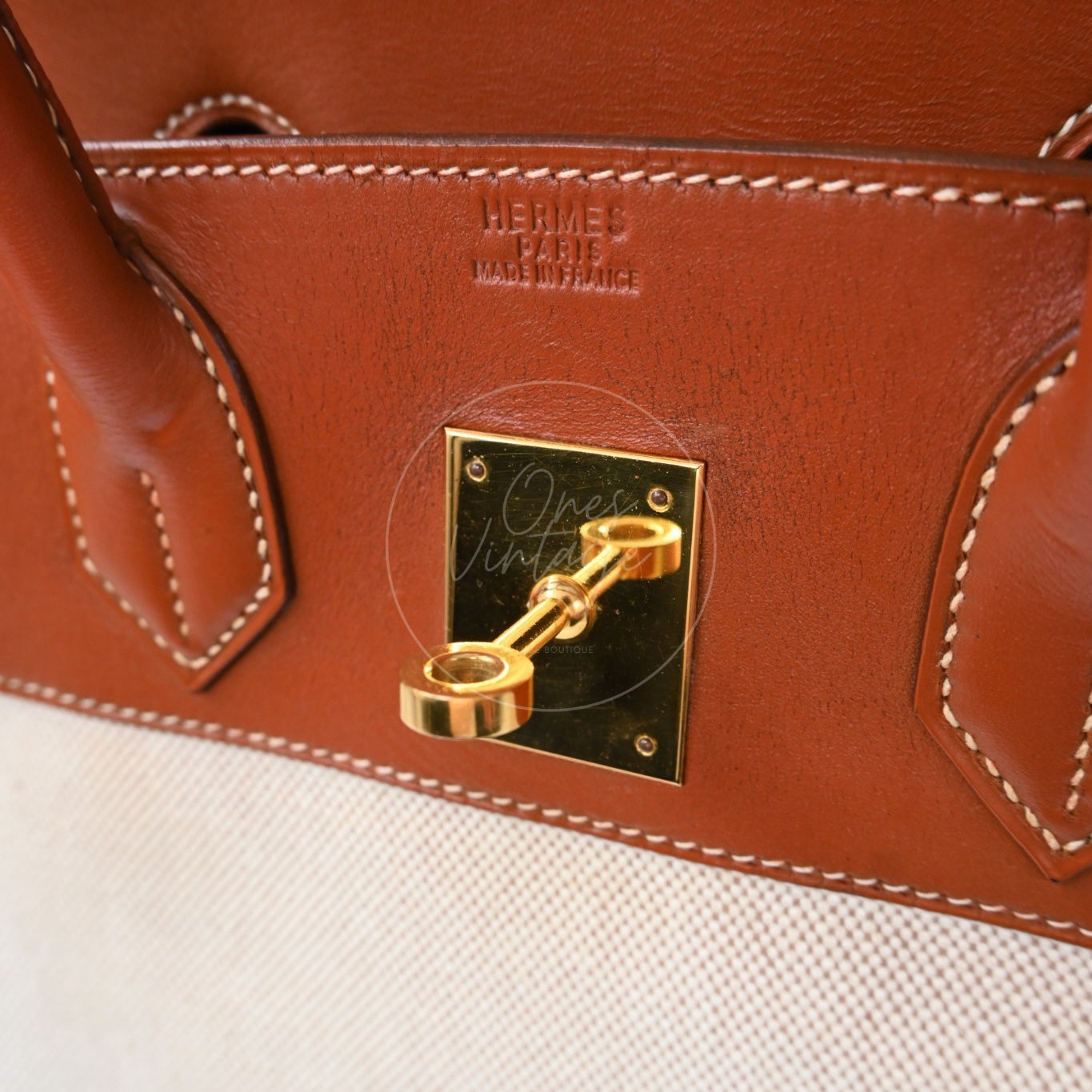 Hermès Haut à Courroies 32 in Fauve Barenia leather and beige toile with gold-tone hardware, Circle X stamp, turn-lock plate and Hermès stamp close-up