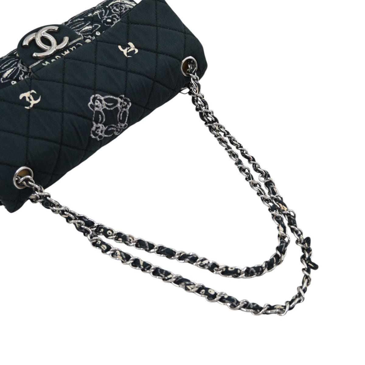 Chanel Small Bandana Single Flap in black quilted cotton with silver-tone hardware, featuring interwoven chain strap and quilted strap attachment, front three-quarter view