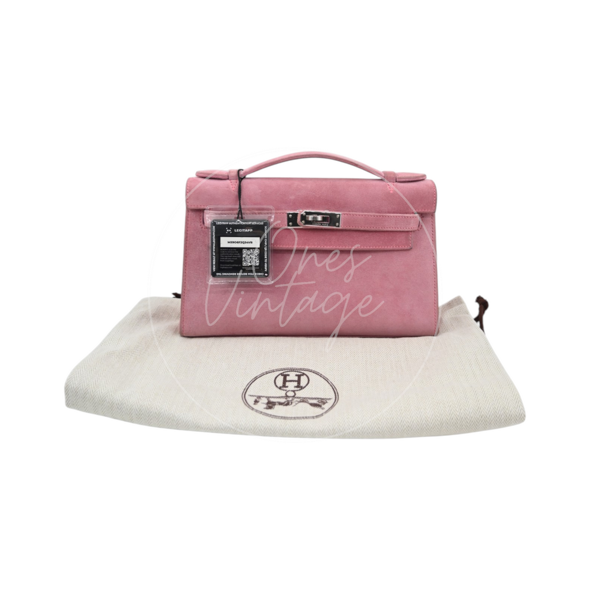 Hermès Kelly Pochette Veau Doblis in pink suede with palladium hardware, featuring turn-lock closure and top handle, front view