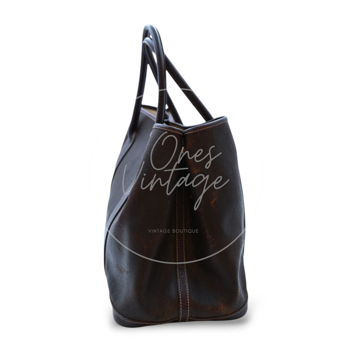 Hermès Garden Party 36 Amazon tote in dark brown rubber with leather trim, right side profile with leather trim and handle