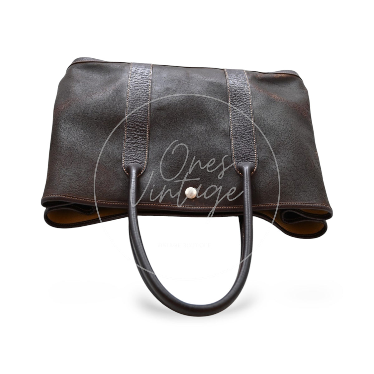 Hermès Garden Party 36 Amazon tote in dark brown rubber with leather trim, top view of handles and open tote compartment