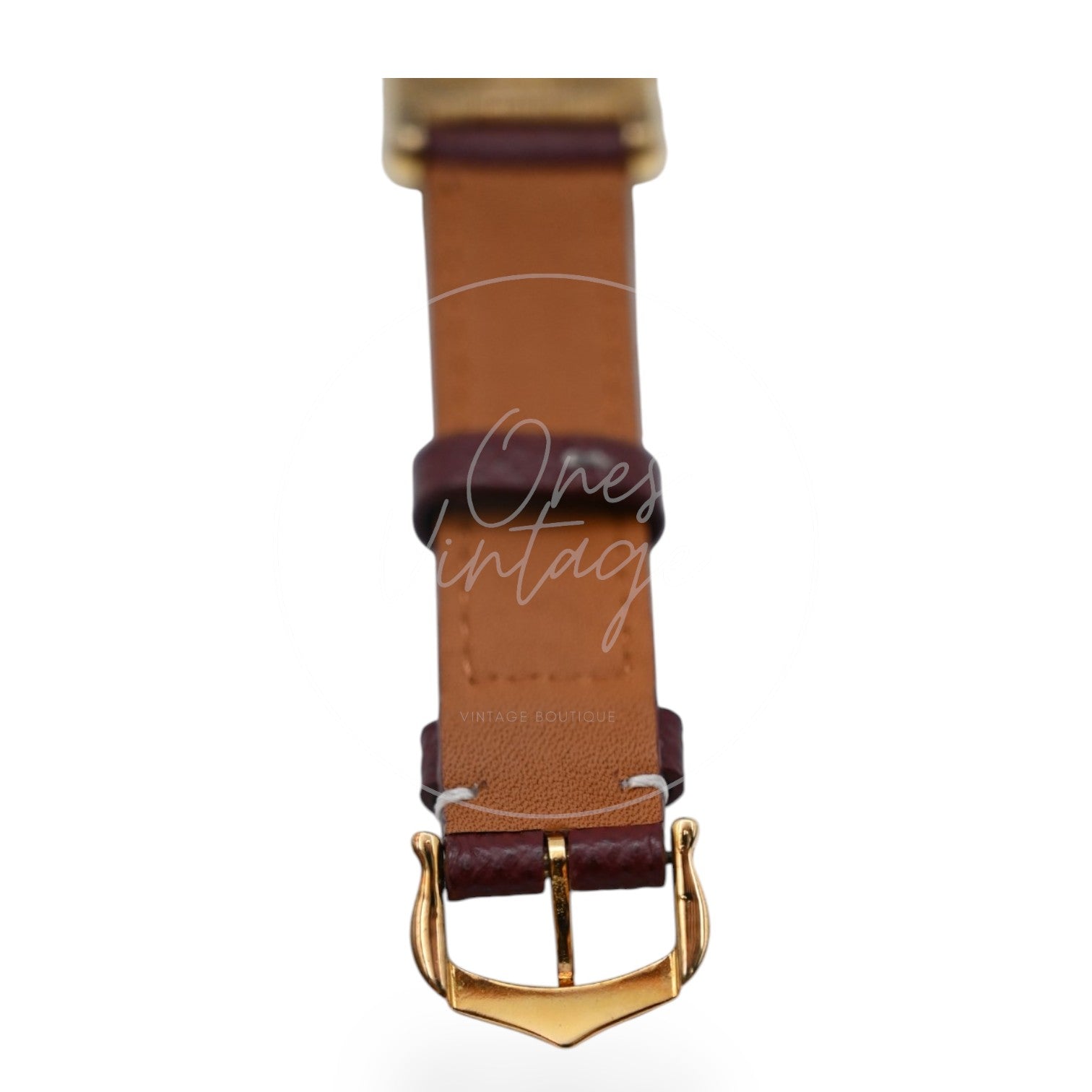 Cartier Must de Tank quartz watch with ivory Roman numeral dial and maroon leather strap, underside of the maroon strap and buckle close-up