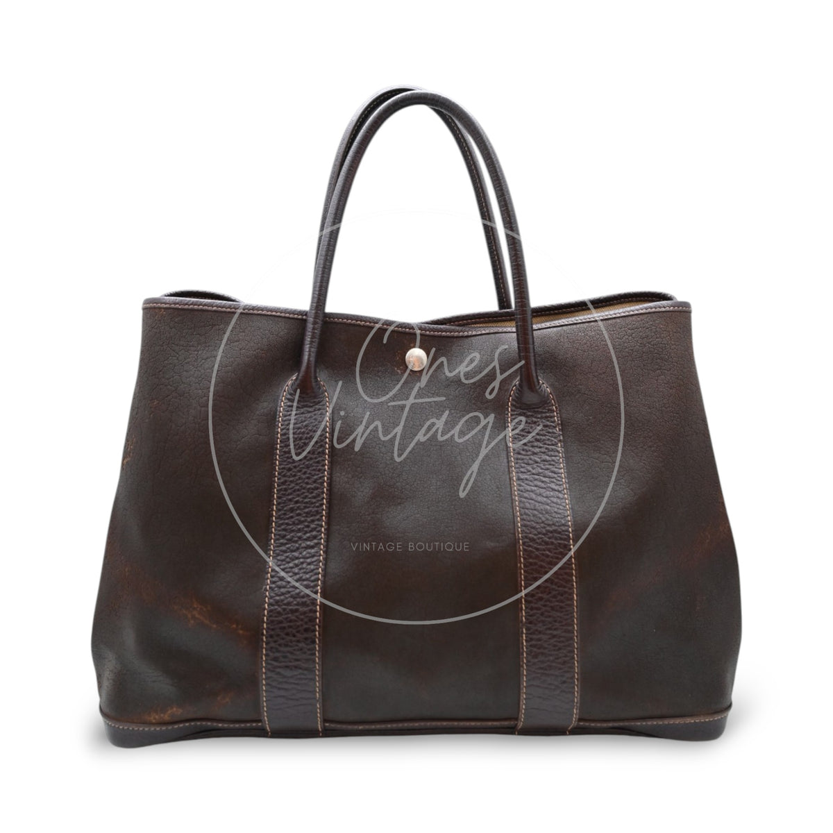 Hermès Garden Party 36 Amazon tote in dark brown rubber with leather trim, rear view showing the textured rubber body