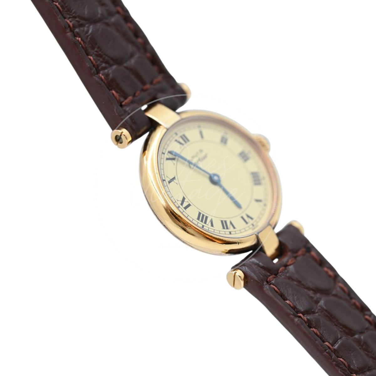 Cartier Must Vendôme SM quartz watch with ivory Roman numeral dial and brown leather strap, angled left profile of round gold-tone case and lugs