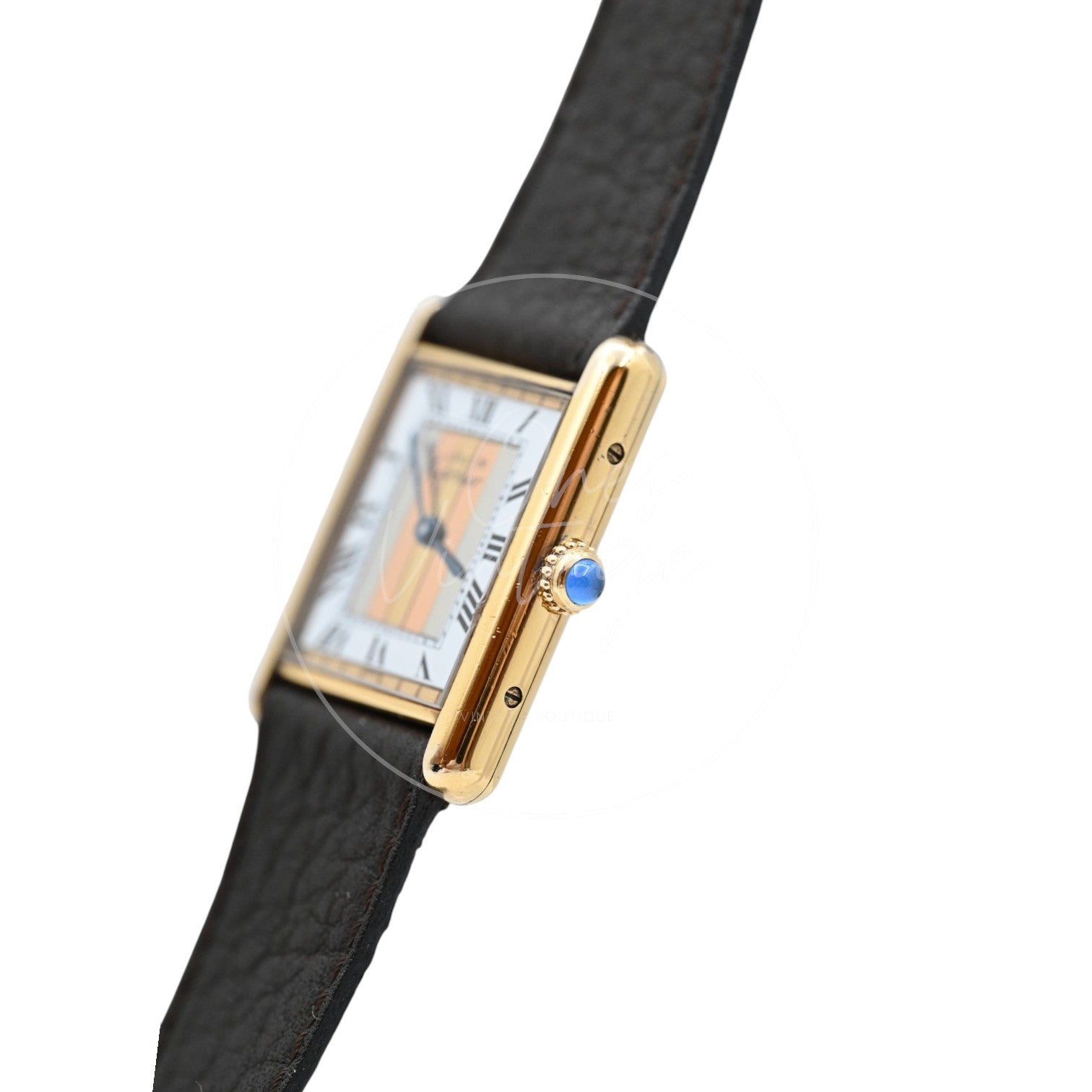 Cartier Must de Tank Trinity dial quartz watch with dark brown leather strap, angled crown-side profile with blue cabochon